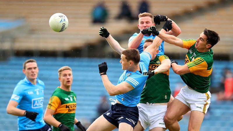 Con O’Callaghan and Ciarán Kilkenny compete in the air with Brian O Beaglaoich and Jason Foley. Photo: Ryan Byrne/Inpho