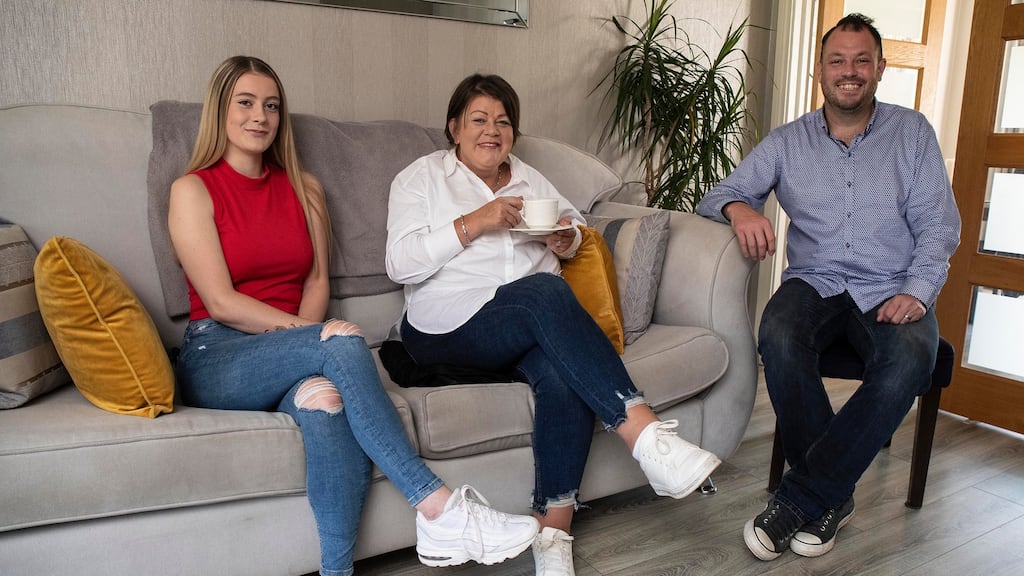 Aisling McConnell (47), centre who is in palliative care for breast cancer, with her husband, Peter, and daughter, Emma Louise, (15), at home in Swords. Photograph: Damien Eagers