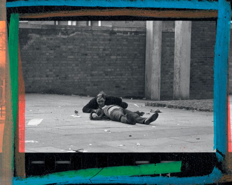 Paddy Walsh creeps towards Patrick Doherty after he was shot. Photograph: Gilles Peress/Magnum