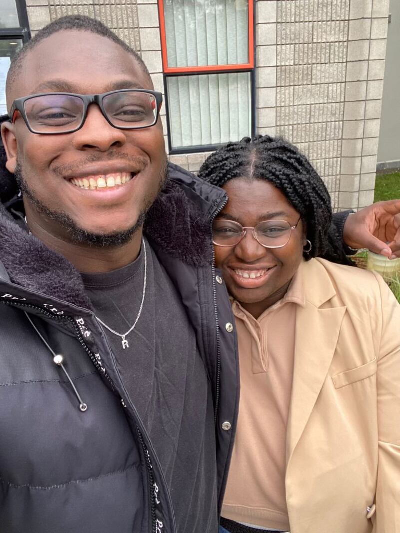 Mistura Oyebanji of Social Democrats smiles with her brother after signing her local election nomination papers in Co Kerry
