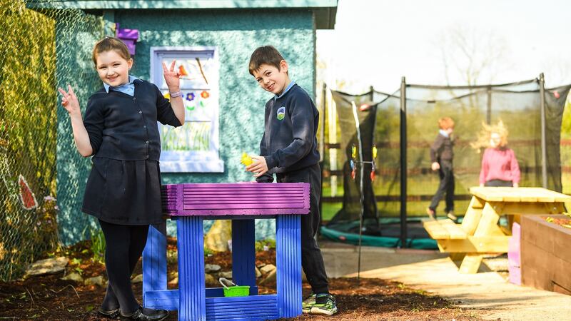 Sonas class students Willow Spratt, Alex O’Shea and Aaron Frewen, along with special needs assistant Ashley Ryan, in their new sensory garden in Anglesboro National School, Co Limerick. Photograph: Diarmuid Greene.