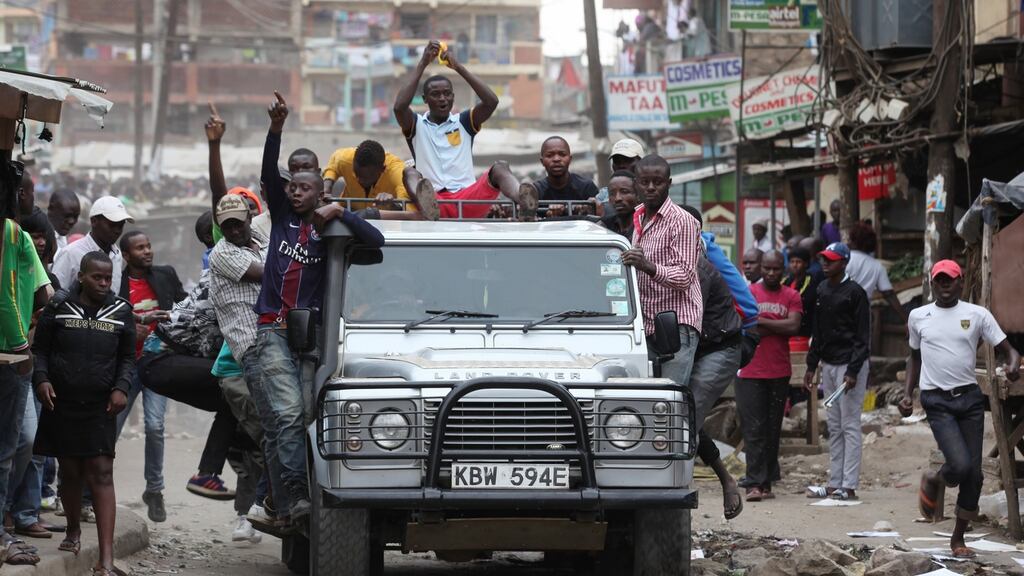 Supporters of opposition leader Raila Odinga protest in Nairobi, Kenya. Riots have been taking place in and around Nairobi since the announcement of Uhuru Kenyatta as president. Photograph: Daniel Irungu/EPA