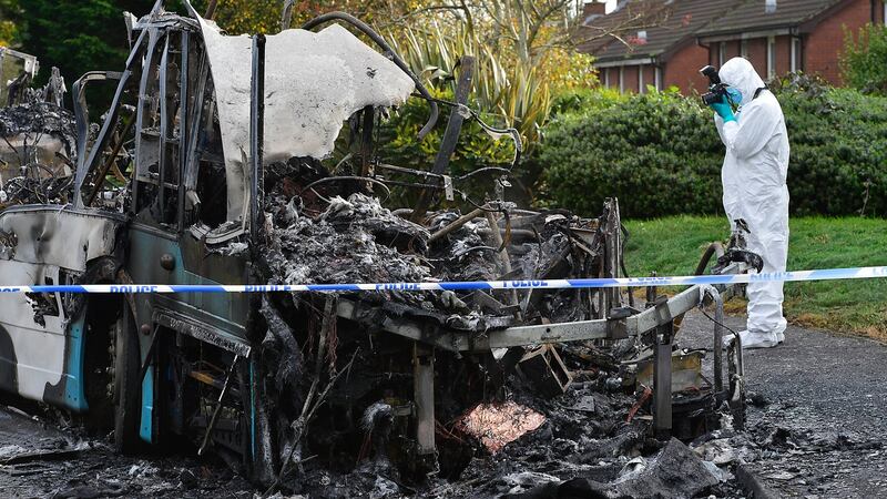 PSNI forensics at the scene after two armed men set a bus alight in the Abbot Drive area of Newtownards. Photograph: Arthur Allison/Pacemaker Press