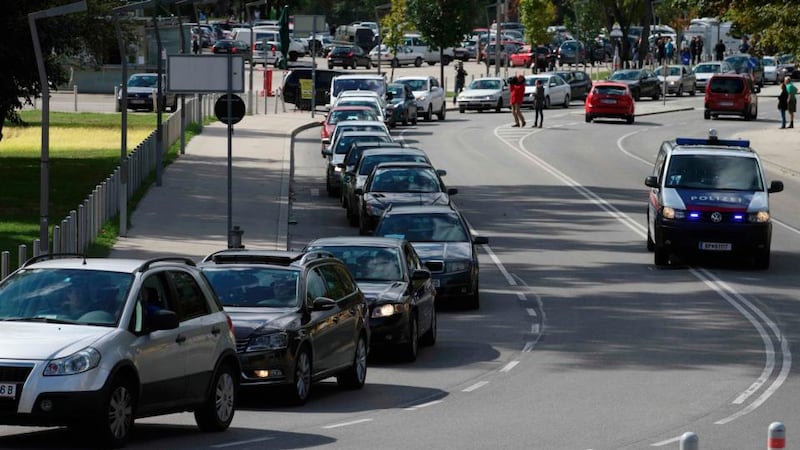 A convoy of around 140 cars leaves for Hungary from Vienna to distribute aid and collect refugees to bring back to Austria. People taking part run the risk of violating laws on human trafficking, police said, but officers were there at the meeting point outside a football stadium just to provide security and guide traffic. Photograph: Heinz-Peter Bader/Reuters