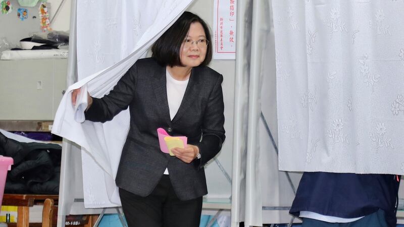 Taiwanese president Tsai Ing-wen emerges from a voting booth at a polling station in New Taipei City during voting in the elections last weekend. Photograph: Chang Hao-an/AP