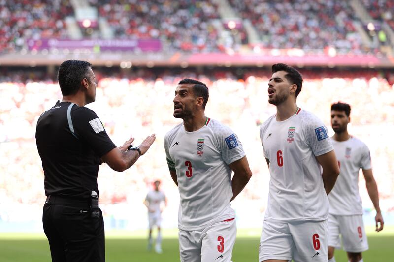 Iran's Ehsan Hajisafi argues with referee Mario Alberto Escobar Toca during the Group B match against Iran at Ahmad Bin Ali Stadium in Doha. Photograph: Richard Heathcote/Getty Images