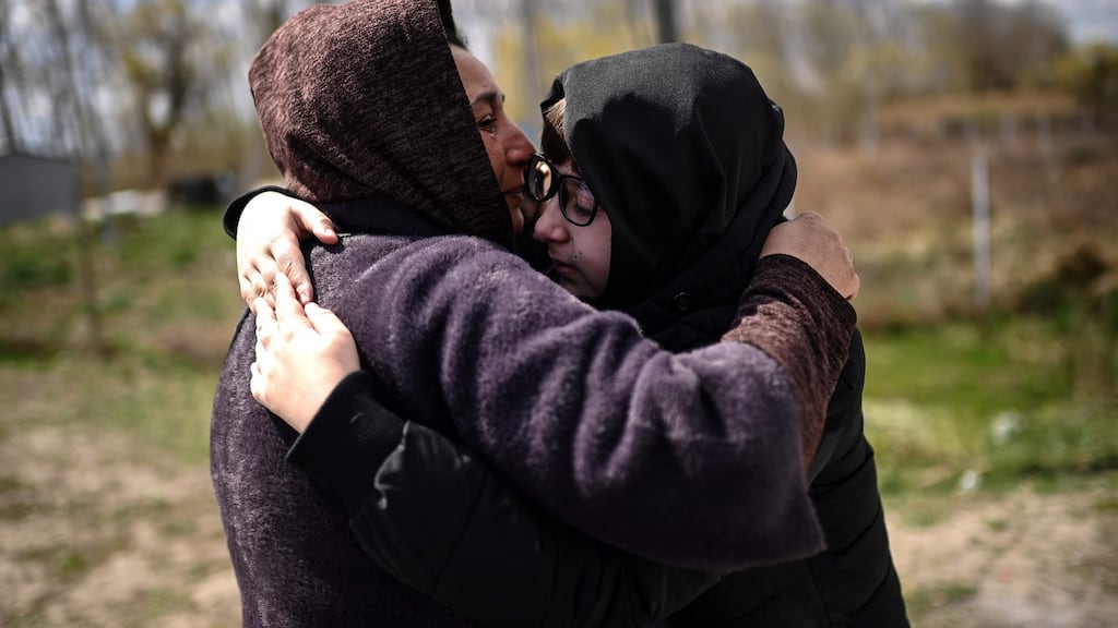 Ukrainian refugees embrace after reuniting: Moldova has, relative to its population, taken in more Ukrainian refugees than any other country.  Photograph: Christophe ArchambaulT / AFP via Getty