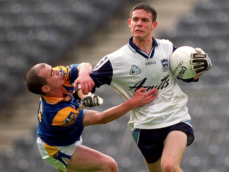 A 19-year-old Stephen Cluxton, shrugs off a challenge by Longford's Pádraic Davis in May 2001. Photograph: Brendan Moran/Sportsfile