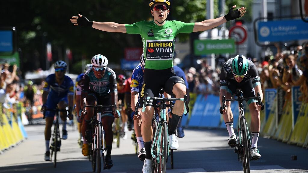 Wout van Aert, Team Jumbo-Vismarider, celebrates as he pips Bora-Hansgrohe rider Sam Bennett (right), to win the fifth stage of the Criterium du Dauphine in Voiron, France. Photograph: Anne-Christing Poujoulat/AFP/Getty