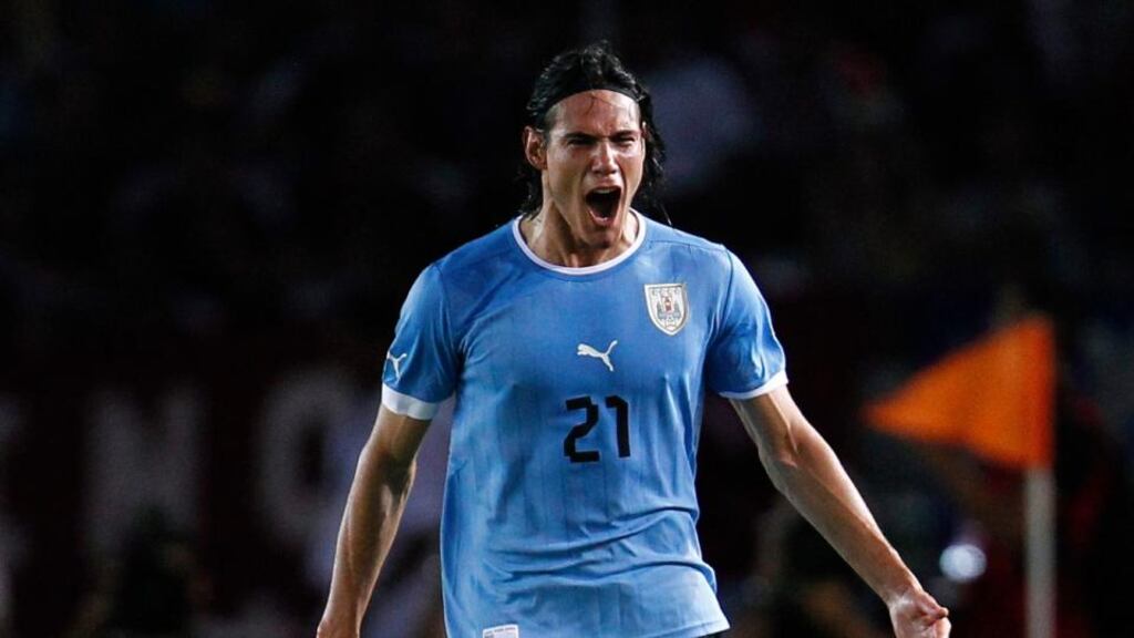 Uruguay’s Edinson Cavani (21) celebrates after scoring against Venezuela during their 2014 World Cup qualifying soccer match in Puerto Ordaz on Tuesday. Photo: Carlos Garcia Rawlins/Reuters