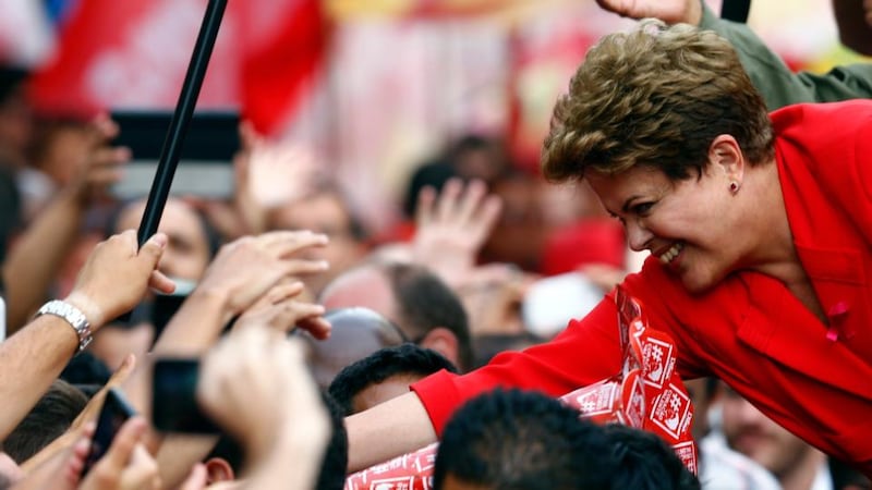 Brazil’s president and Workers’ Party (PT) presidential candidate Dilma Rousseff greets supporters in Porto Alegre. Photograph: Paulo Whitaker/Reuters.