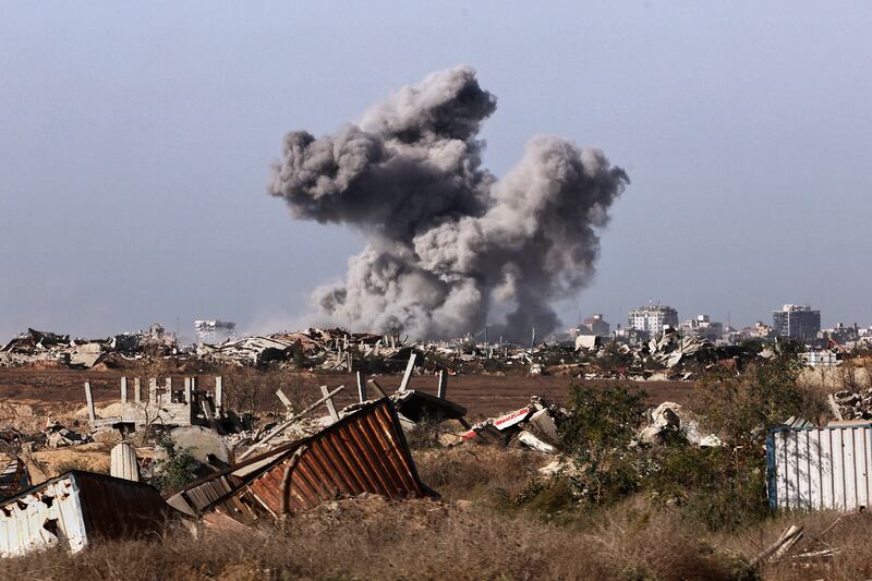 A plume of smoke rises above Gaza city. Photograph: Jack Guez/Pool/AP