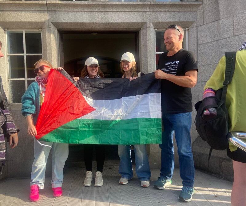 Sara White (39), left, from Blackrock, protests at the Department of Justice