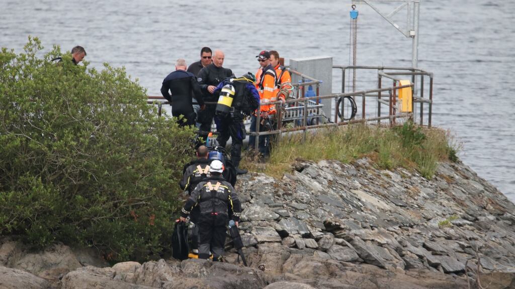 Members of the Coast Guard during the search at Lough Keel in Donegal, where a father and son died. Photograph: North West Newspix