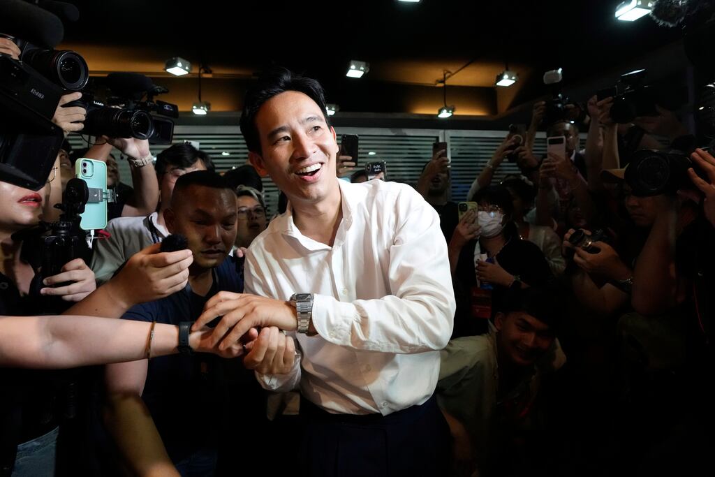 Leader of Move Forward party Pita Limjaroenrat shakes hand with a supporter. Photograph: Sakchai Lalit/AP