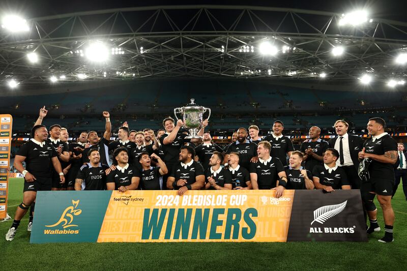 The All Blacks celebrate with the Bledisloe Cup after winning the Rugby Championship & Bledisloe Cup, beating Australia in Sydney. Photograph: Cameron Spencer/Getty Images