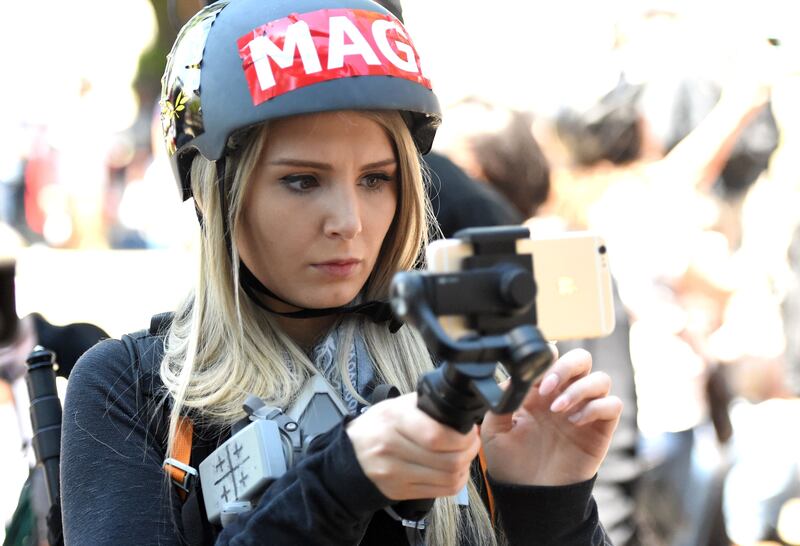 Lauren Southern streaming a live video during a rally in California in 2017. Photograph: Josh Edelson/AFP via Getty