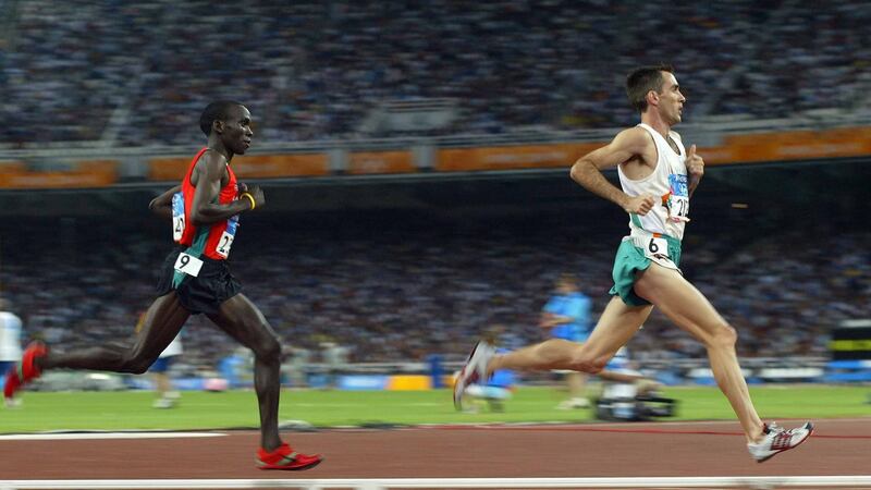 Ireland’s Mark Carroll leads Eliud Kipchoge in the Men’s 5,000m heats at the 2004 Olympic Games in Athens. Photograph: Patrick Bolger/Inpho