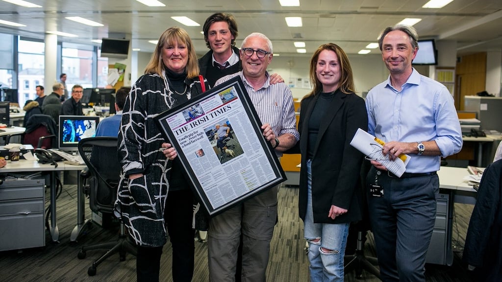 Peter Murtagh and his wife Moira and children Patrick and Natasha, with  editor of The Irish Times  Paul O’Neill in the Irish Times newsroom. Photograph: James Forde