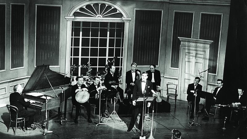 Ceoltóirí Chualann on stage for Ó Riada sa Gaiety in March 1969, (l–r): Seán Ó Riada, Peadar Mercier, Éamon de Buitléar, Martin Fay, Seán Keane, John Kelly, Seán Potts, Michael Tubridy and Paddy Moloney. Seán Ó Sé is at the front. Photograph: Gael Linn