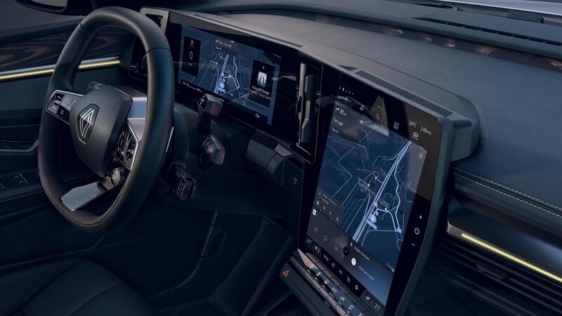 The roomy interior gets two massive screens