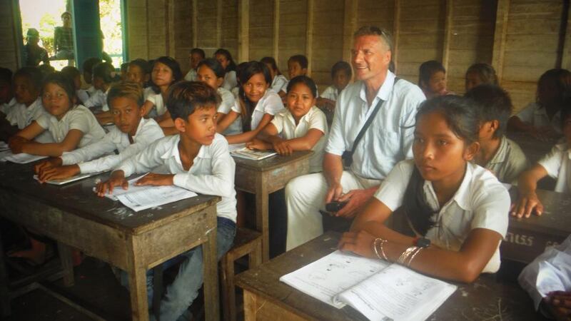 Irish teacher Timothy O’Connor, who has been working in Cambodia for more than a year, with pupils in a classroom at Kampong Brock