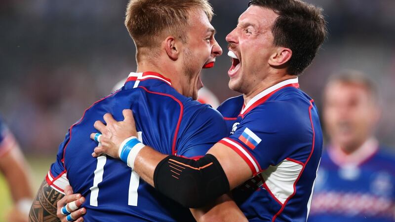 Russia captain Vasily Artemyev celebrates with Kirill Golosnitskiy after the winger scored the opening try of the tournament. Photograph: Cameron Spencer/Getty