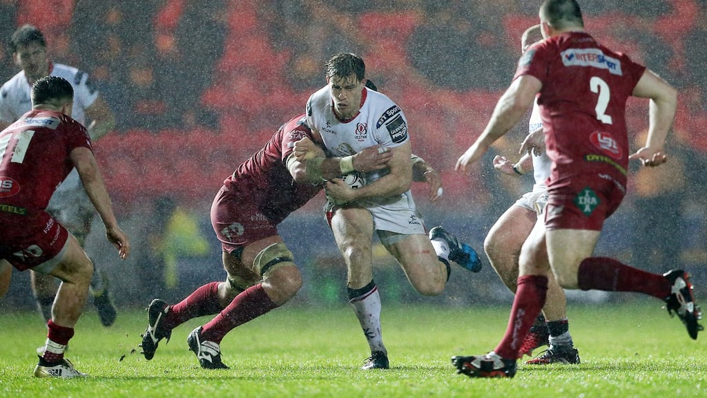 Ulster’s Andrew Trimble is tackled by Tom Price during his side’s narrow defeat to Scarlets. Photograph: InphoChris Fairweather