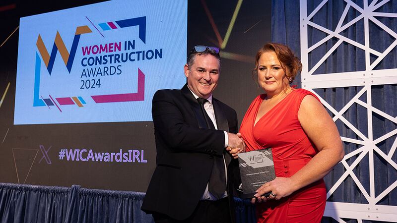 Darragh Elliott, managing director, Elliott Group, presents the business owner of the year award to Brenda Sorensen, Aspect Interior Design