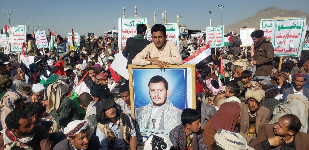 A protester in Sanaa, Yemen, with a poster of  Houthi leader Abdul-Malik al-Houthi during a rally against US and British airstrikes on Houthi targets. Photograph: Yahya Arhab/EPA