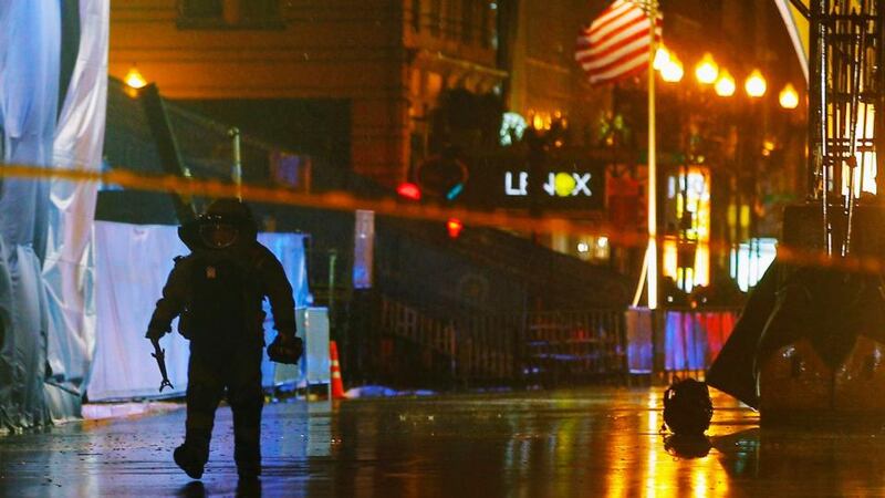 A member of the police bomb squad walks away from a bag left on the road near the finish line of the Boston Marathon. Photograph: Brian Snyder/Reuters