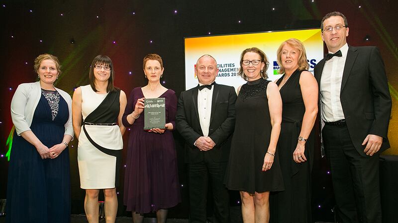 Roger Brennan, Managing Director, Aramark presents the FM Project of the Year - Public Sector award to Office of Government Procurement Team