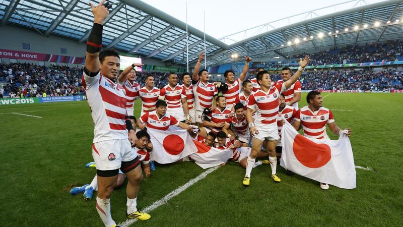 Japan players celebrate their surprise win over South Africa during the 2015 Rugby World Cup Pool B match at Brighton. Photograph:  Steve Bardens/Getty Images