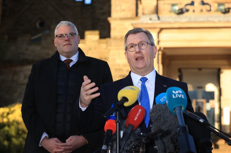 DUP leader Jeffrey Donaldson (right) and party colleague Gavin Robinson speak to the media at Stormont. Powersharing in Northern Ireland is set to return after the DUP party executive backed a UK government deal aimed at addressing its concerns over post-Brexit trade barriers. Photograph: Liam McBurney/PA