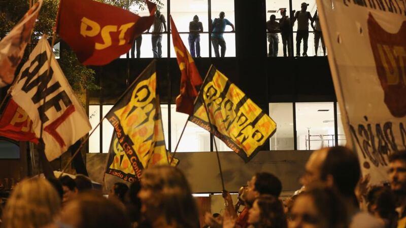 Demonstrators march before clashes begin on ‘Teachers’ Day’ at a mostly peaceful protest by teachers and supporters calling for better public education and services. Photograph: Mario Tama/Getty Images