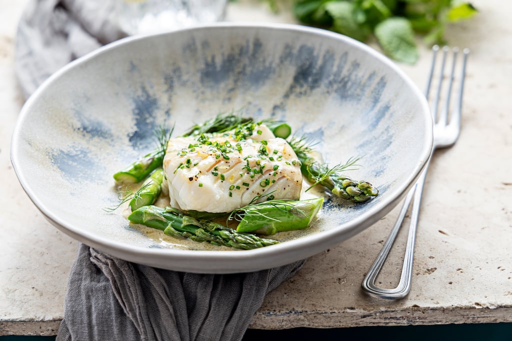 Steamed cod with asparagus and vinegar butter makes a delicious light supper. Photograph: Harry Weir