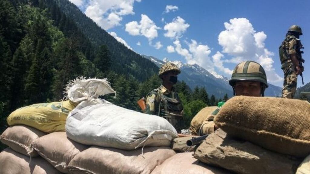 Indian Border Security Force soldiers guard a highway leading towards Leh, bordering China. Photograph: Tauseef Mustafa/AFP