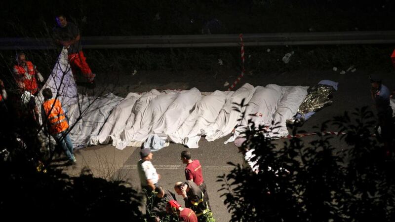 Bodies of victims are lined up after a coach crash near the southern town of Avellino yesterday. Photograph: Reuters