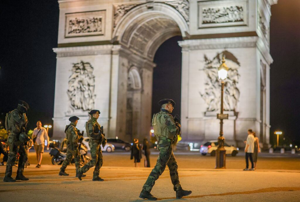French soldiers, part of the national security plan 'Vigipirate', keep watch as they secure the area near the Arc de Triomphe, in Paris, France on July 3rd. Photograph: Olivier Matthys/EPA