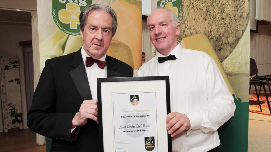 Aiden Cotter of Bord Bia pictured presenting an award to Tom Burgess of Coolattin Cheddar for their Mount Leinster Clothbound at the Irish Cheese Awards at The Grainstore, Ballymaloe House in Cork. Photograph: Diane Cusack