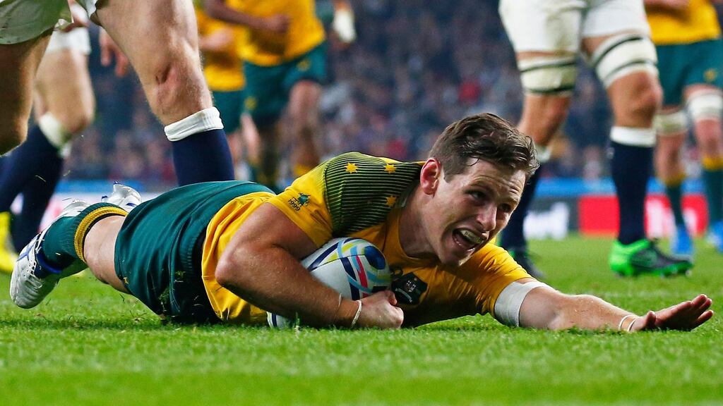 Australia’s outhalf Bernard Foley scores a try against England. Photograph: Andrew Winning/Livepic