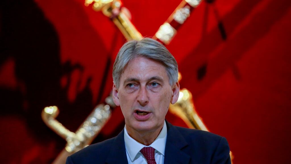 For moderate Brexiters and Remainers, there could be an alternative to Philip Hammond’s strategy of a transitional agreement - re-entering the EU under Article 49 of the Lisbon treaty. (Photographer: Luke MacGregor/Bloomberg)