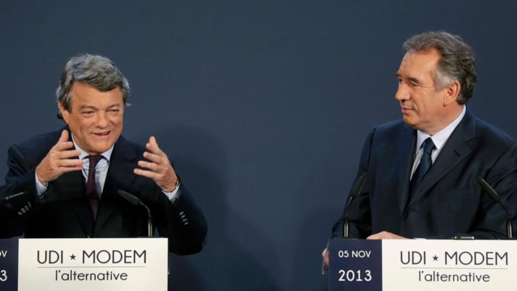Jean-Louis Borloo (L), head of the Union Democratic Independant (UDI) political party, and Francois Bayrou, centrist MoDem political party leader, attend a news conference to announce the union of their centrist parties yesterday. REUTERS/Jacky Naegelen
