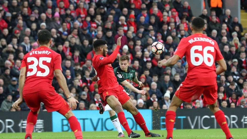 No-win situation: Plymouth Argyle’s Craig Tanner has a shot blocked at Anfield. Photograph: Martin Rickett/PA