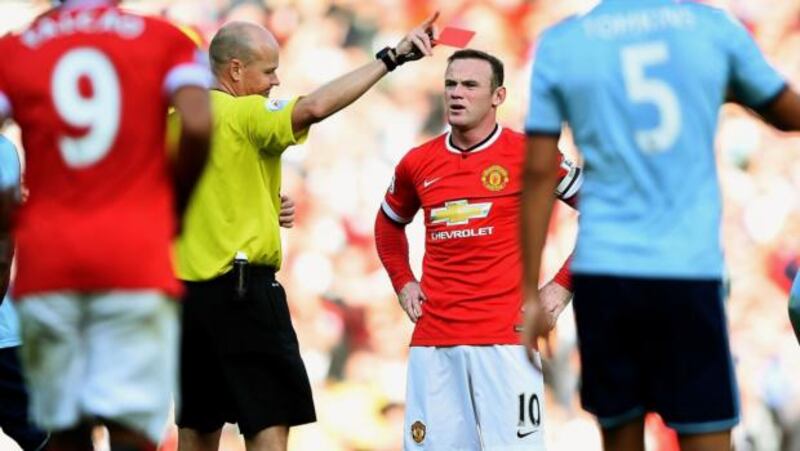 Wayne Rooney of Manchester United receives a straight red card from referee Lee Mason after a foul on Stewart Downing of West Ham at Old Trafford. Photograph: Laurence Griffiths/Getty Images