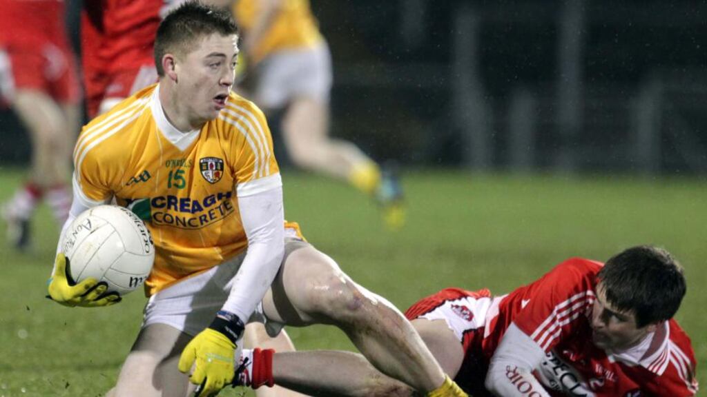 Antrim’s Brendan Bradley and Derry’s Gareth McKinless.