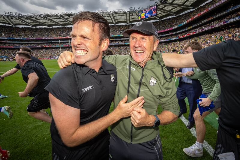 Kerry manager Jack O'Connor and his son Cian O'Connor celebrate at the final whistle. Photograph: Morgan Treacy/Inpho