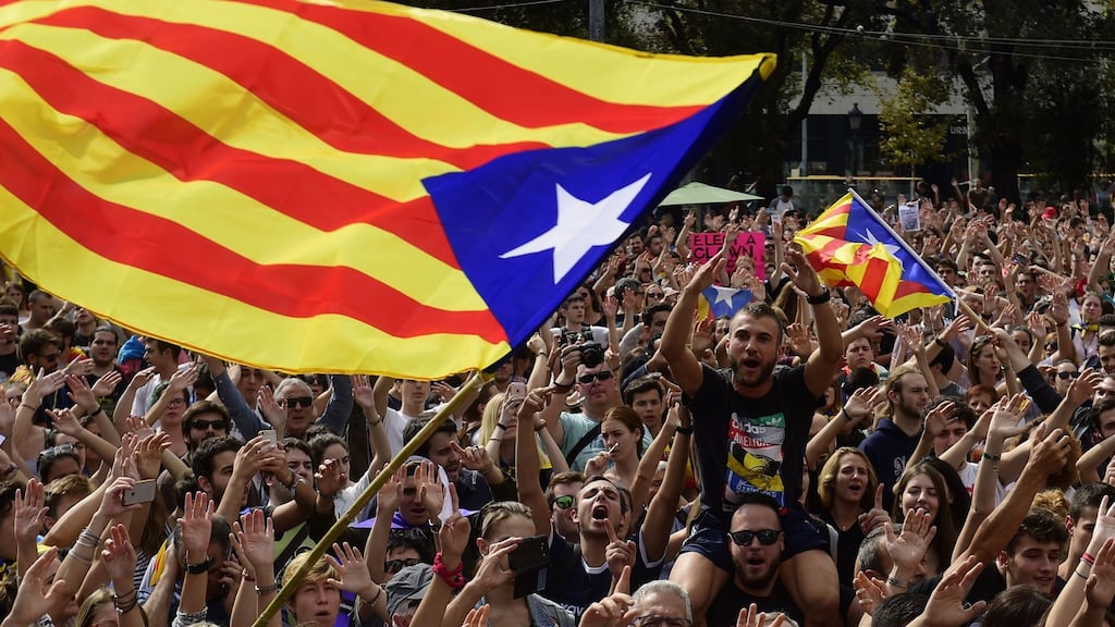People shout slogans as they wave Catalan pro-independence ‘Estelada’ flags during a protest in Barcelona on Monday. Photograph: Pierre-Philippe Marcou/AFP/Getty Images