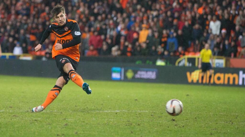 Dundee United’s Charlie Telfer scores his side’s sixth goal against Dundee. Photograph: Jeff Holmes/PA Wire.