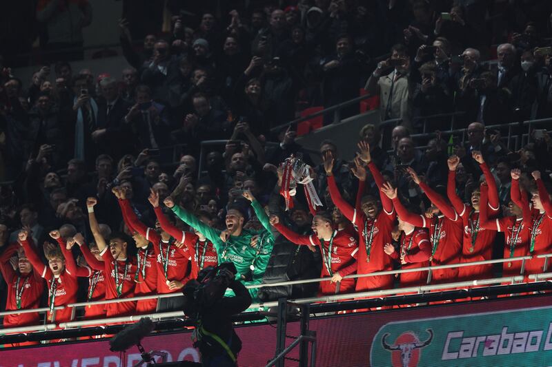 Manager Jurgen Klopp and defender Virgil van Dijk lift the trophy as Liverpool celebrate their Carabao Cup final victory over Chelsea at Wembley Stadium. Photograph: Adrian Dennis/AFP